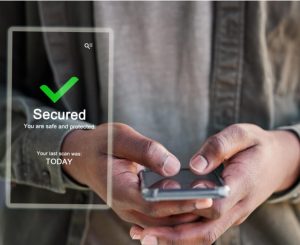 Man holding a phone with “secured” label